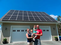 Family-In-Front-of-Solar-Panels-1