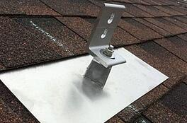 Asphalt shingle roof with solar panel mounting unit