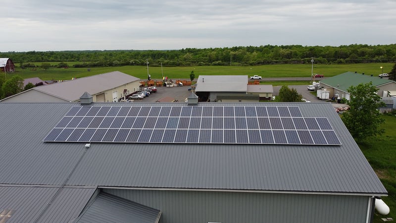 Pictures is solar panels installed on a metal ribbed roof