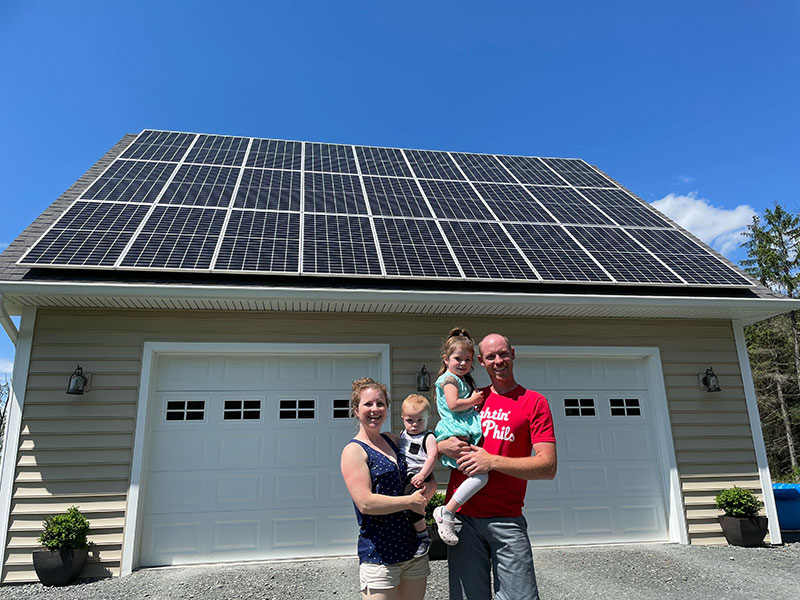 Family-In-Front-of-Solar-Panels