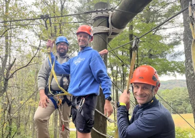 Andy and Warren on the high ropes course at the 2025 fall sales meeting.